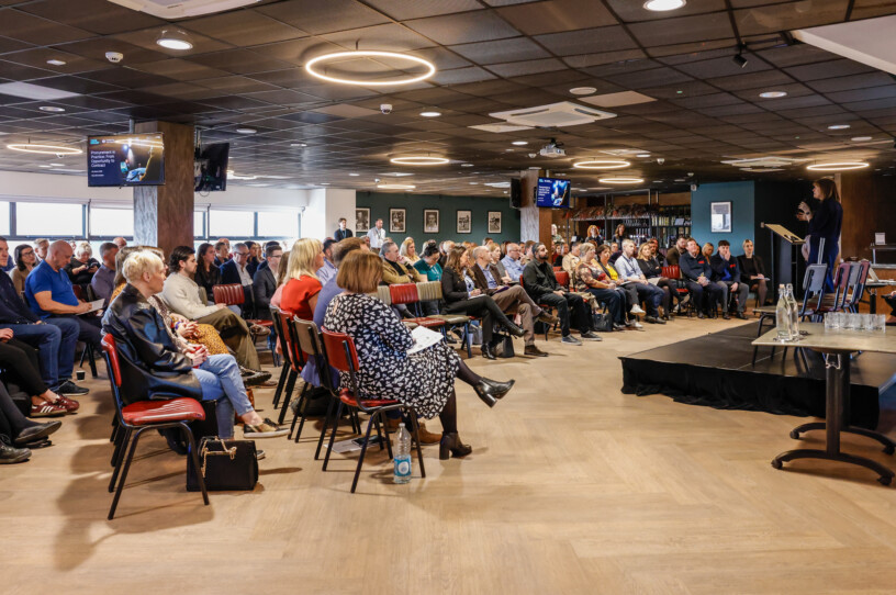 Audience listening to speaker at a procurement event